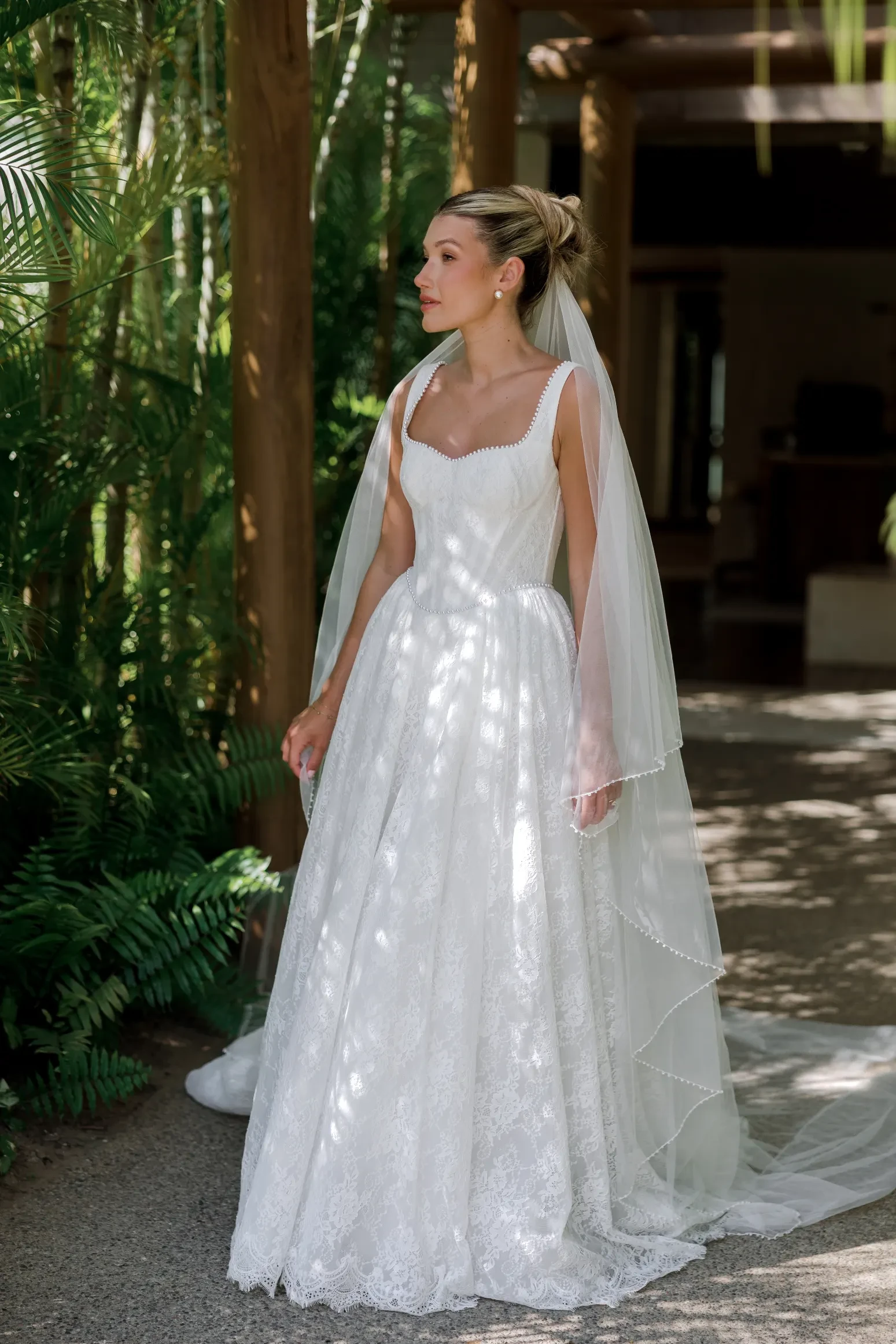 Model displaying a white wedding dress by Locket