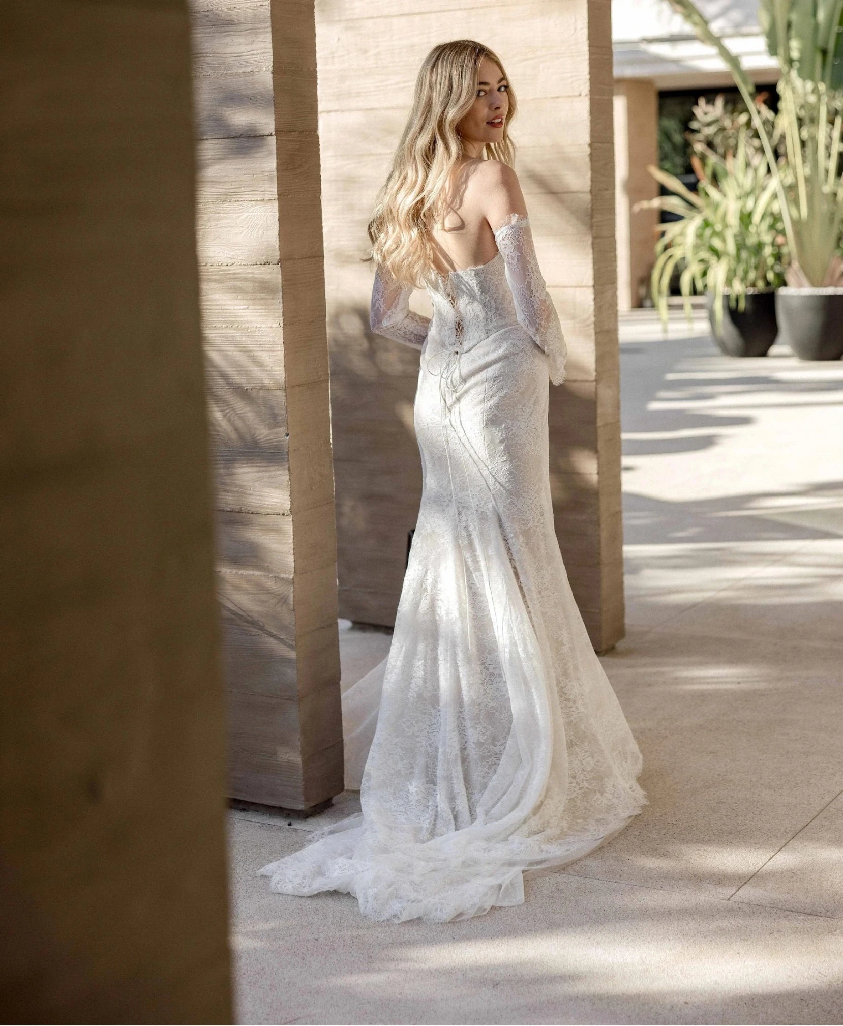 Model wearing white wedding dress by Wtoo by Watters