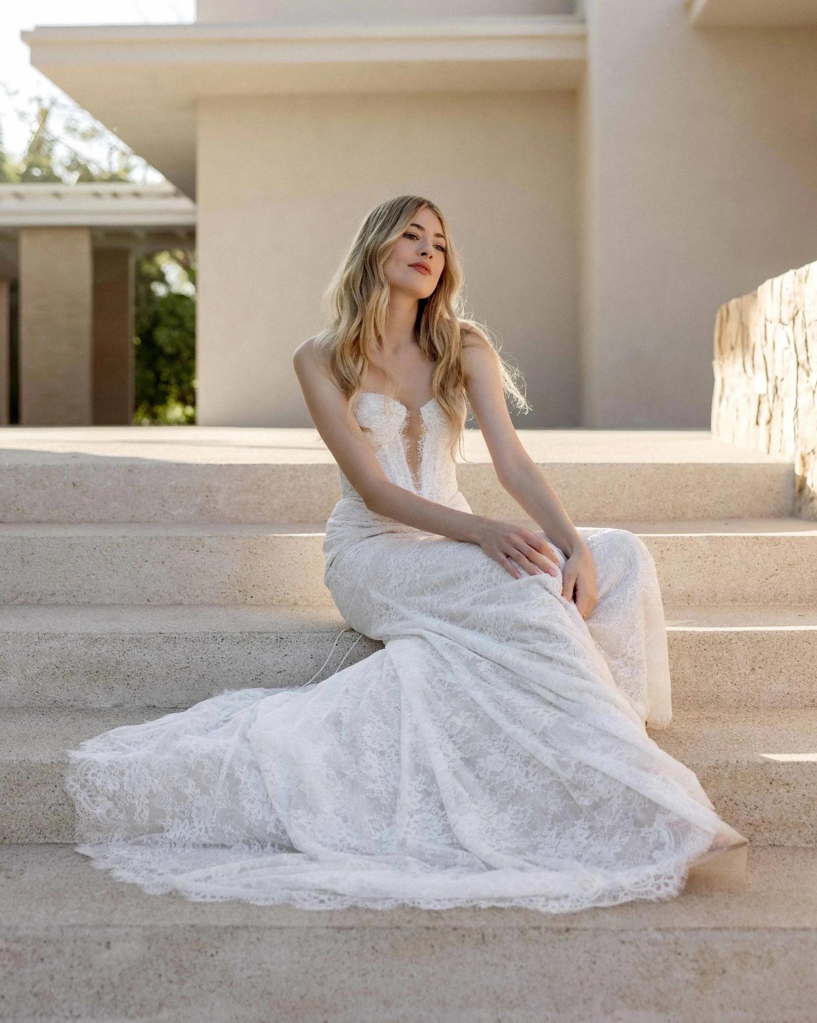Model displaying a white wedding dress by Wtoo by Watters