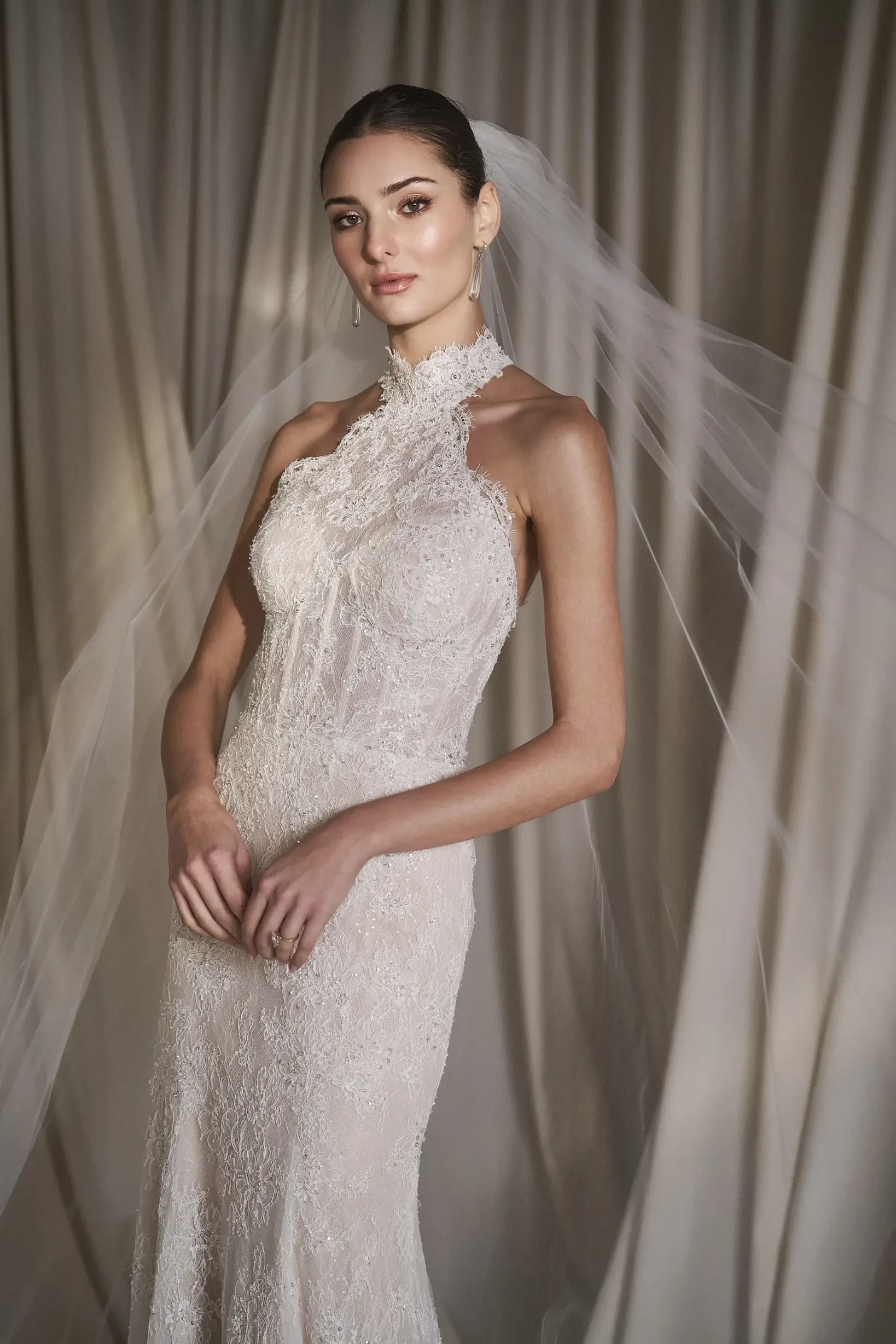 Model wearing a wedding dress by Wtoo by Watters