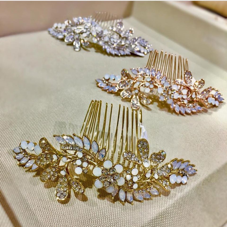 Two gold hair clips and one silver hair clip